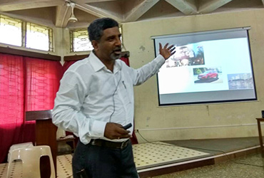 Instructor leading a corporate wellness session focused on Stress Management techniques